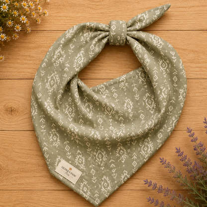 Juniper Trail dog bandana featuring a sage green background with a western-inspired geometric pattern in soft cream tones by HoneyPaw Pets.