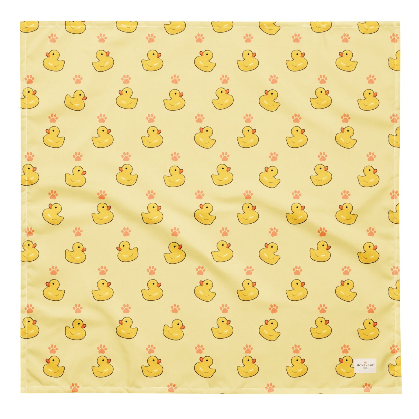 Lucky Duck dog bandana featuring rubber ducks and paw prints on a yellow background by HoneyPaw Pets