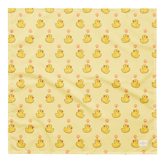 Lucky Duck dog bandana featuring rubber ducks and paw prints on a yellow background by HoneyPaw Pets