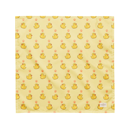 Lucky Duck dog bandana featuring rubber ducks and paw prints on a yellow background by HoneyPaw Pets
