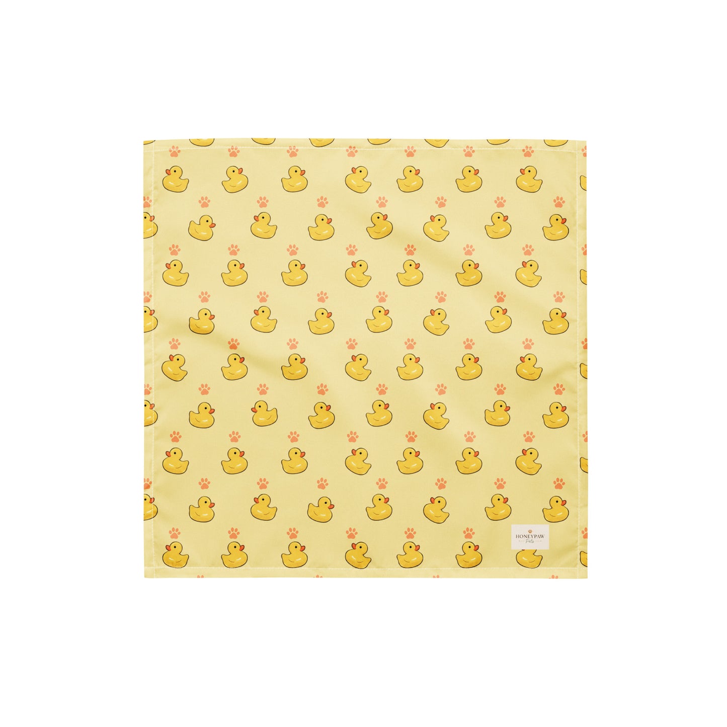 Lucky Duck dog bandana featuring rubber ducks and paw prints on a yellow background by HoneyPaw Pets