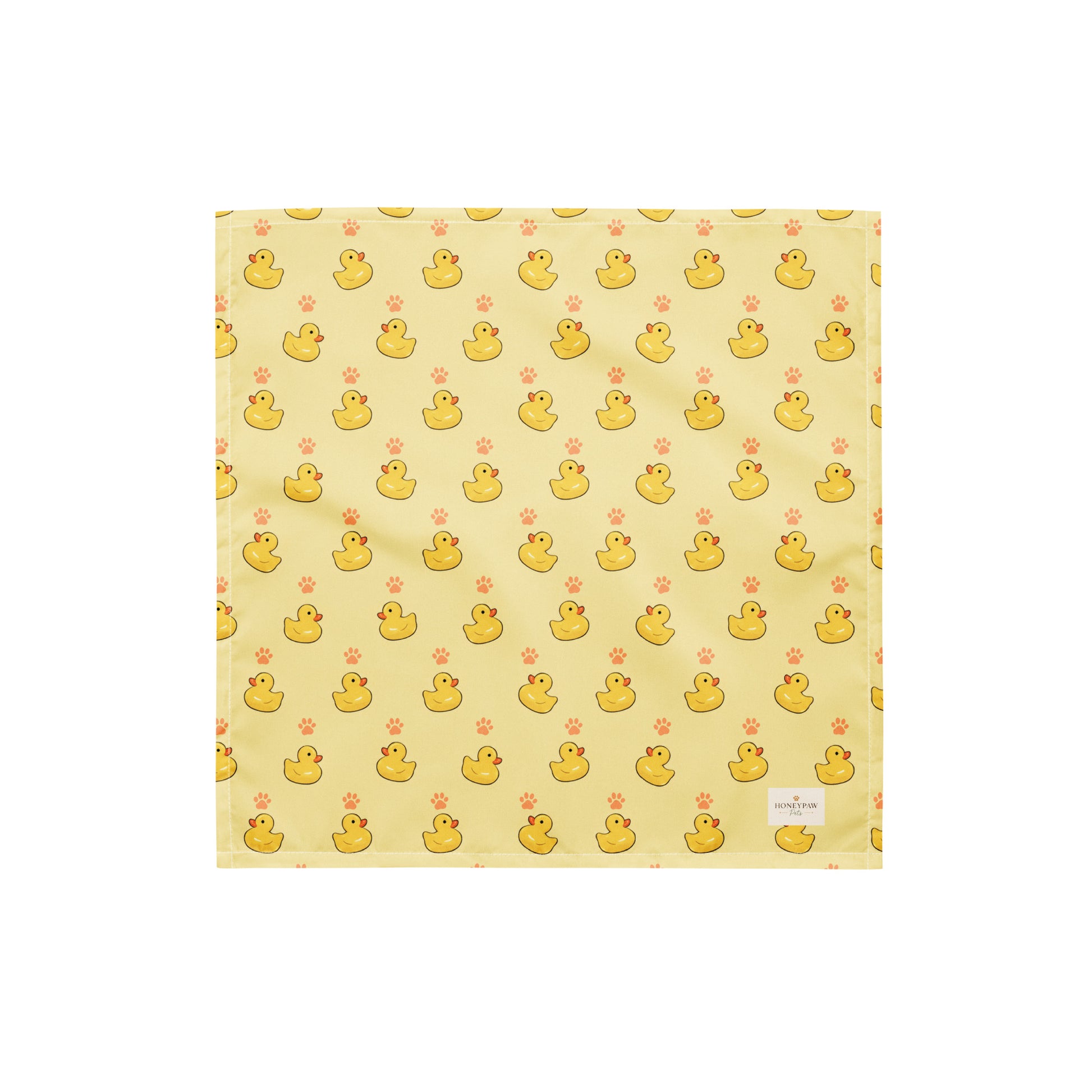 Lucky Duck dog bandana featuring rubber ducks and paw prints on a yellow background by HoneyPaw Pets