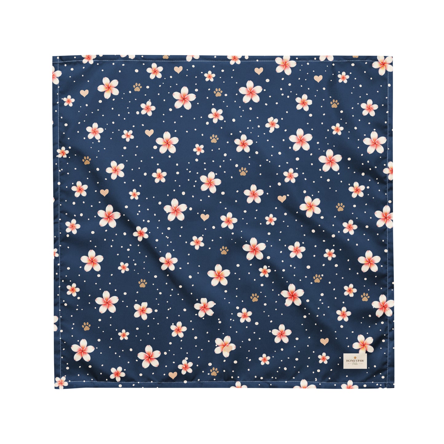 Moonlit Plumeria dog bandana featuring a white plumeria floral pattern on a navy blue background by HoneyPaw Pets.
