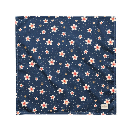 Moonlit Plumeria dog bandana featuring a white plumeria floral pattern on a navy blue background by HoneyPaw Pets.