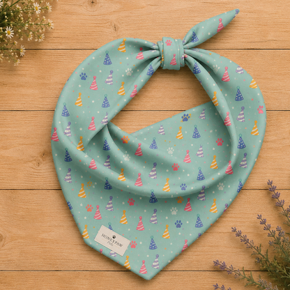 Party Animal birthday dog bandana featuring colorful party hats and paw prints on a mint green background by HoneyPaw Pets