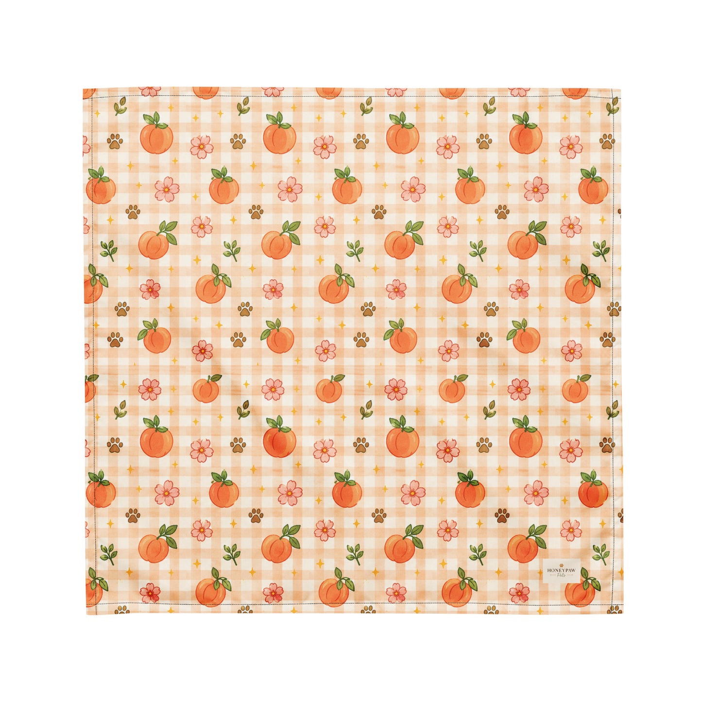 Peachy Pup dog bandana featuring ripe peaches, floral accents, and a soft peach plaid pattern on a cream background by HoneyPaw Pets.