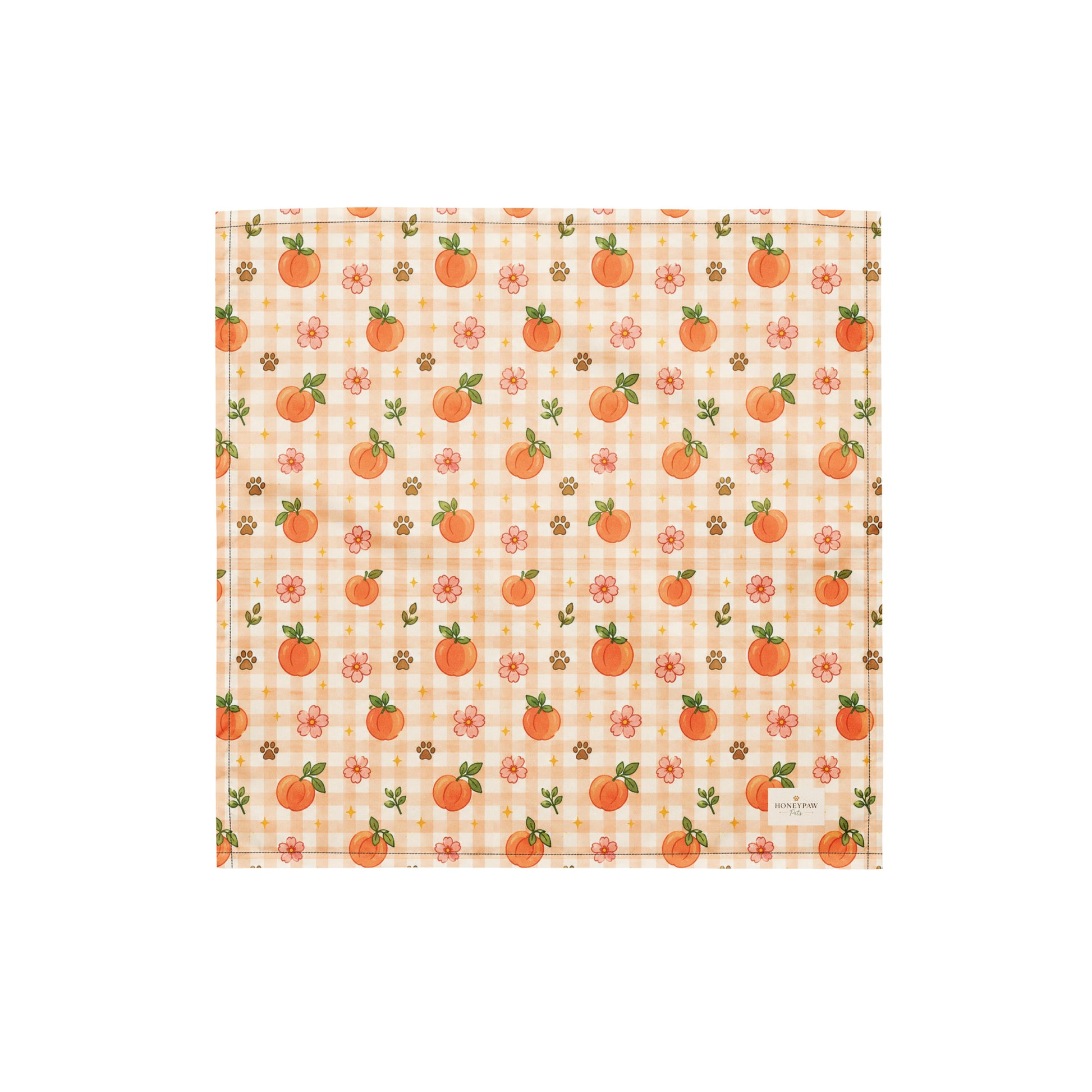 Peachy Pup dog bandana featuring ripe peaches, floral accents, and a soft peach plaid pattern on a cream background by HoneyPaw Pets.