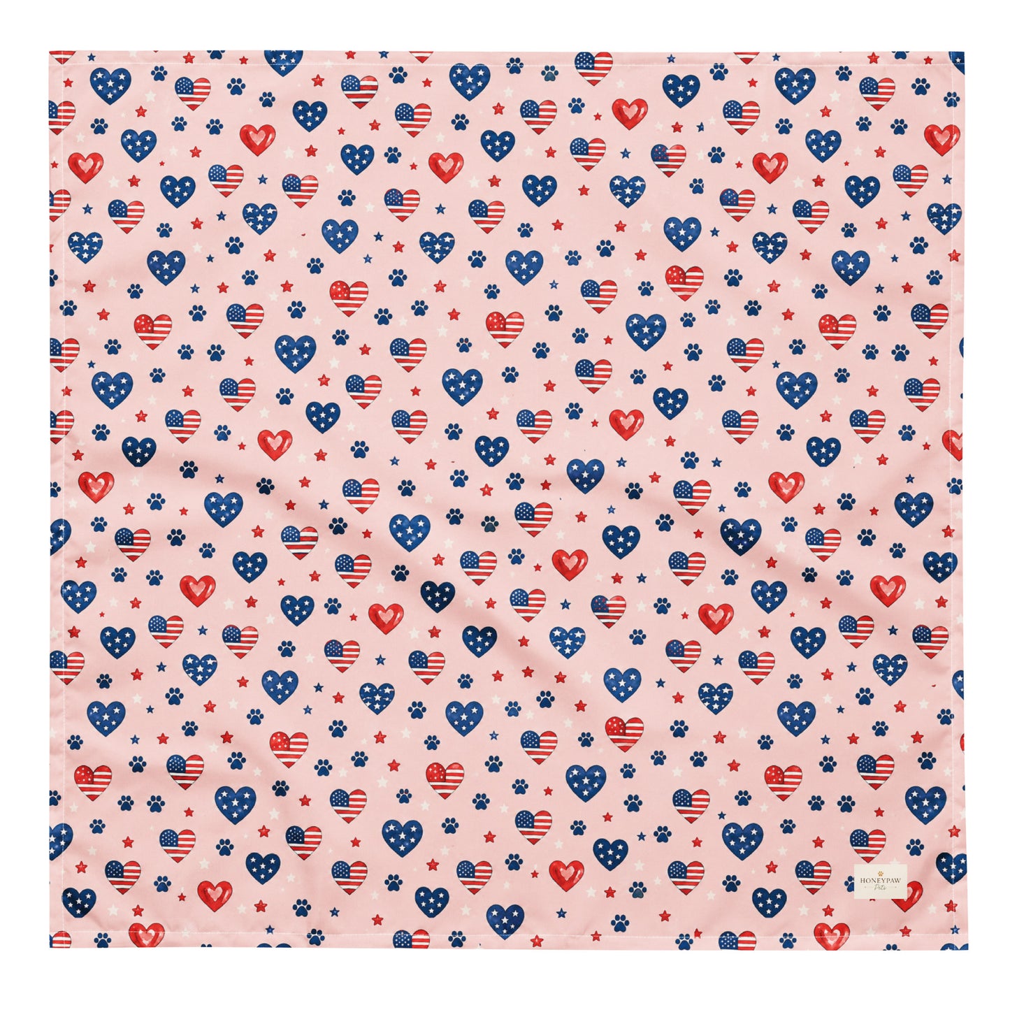 Picnic Hearts dog bandana featuring patriotic heart and paw print patterns on a blush pink background by HoneyPaw Pets.