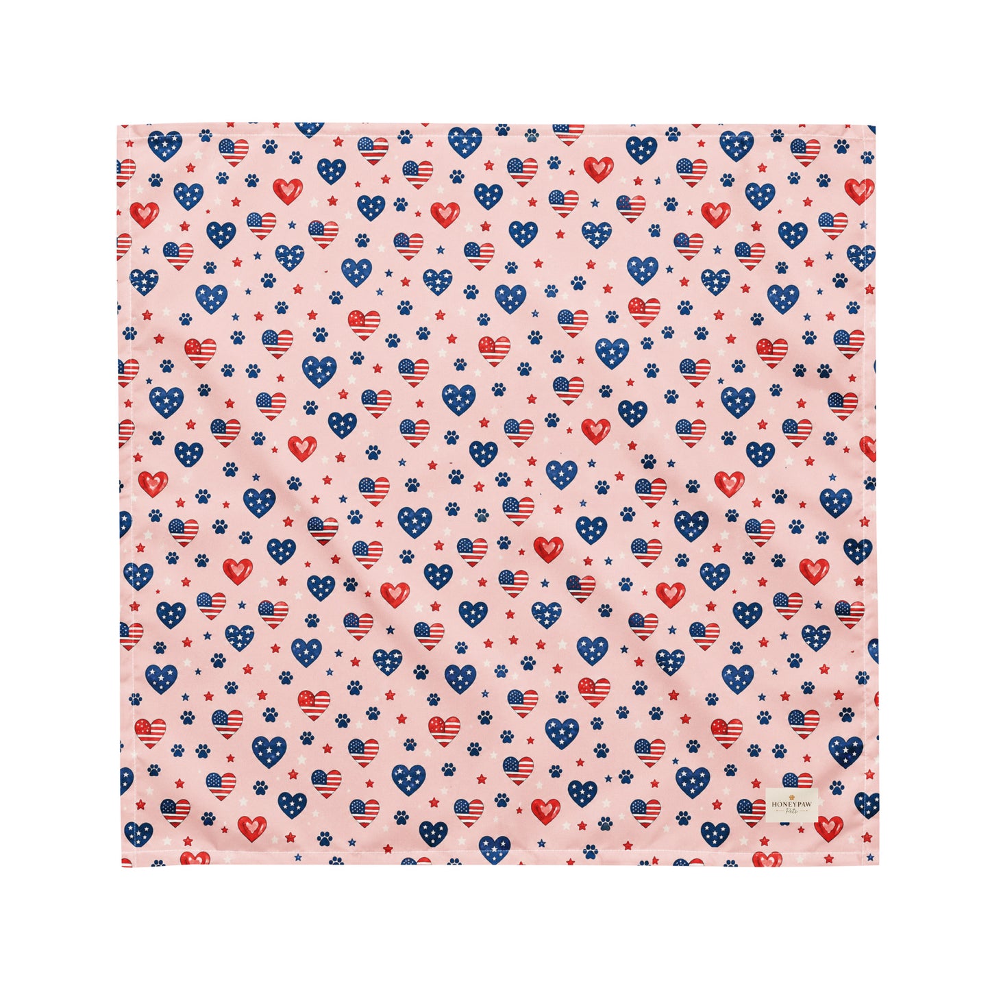 Picnic Hearts dog bandana featuring patriotic heart and paw print patterns on a blush pink background by HoneyPaw Pets.