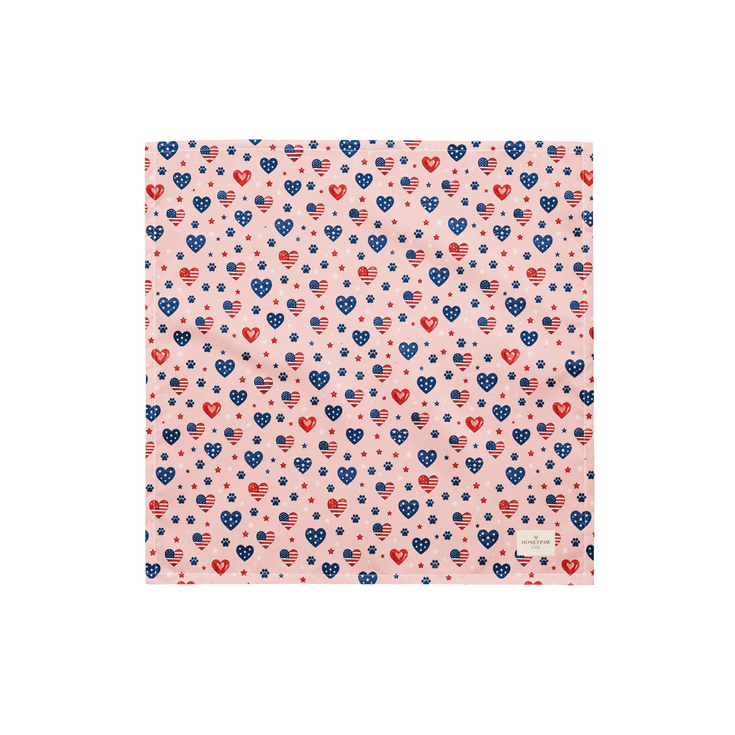 Picnic Hearts dog bandana featuring patriotic heart and paw print patterns on a blush pink background by HoneyPaw Pets.