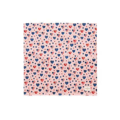 Picnic Hearts dog bandana featuring patriotic heart and paw print patterns on a blush pink background by HoneyPaw Pets.