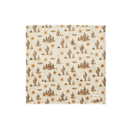Prickly Pup dog bandana featuring a cream background with hand-drawn desert cacti, sunshine motifs, and southwestern-inspired details in warm earth tones by HoneyPaw Pets.