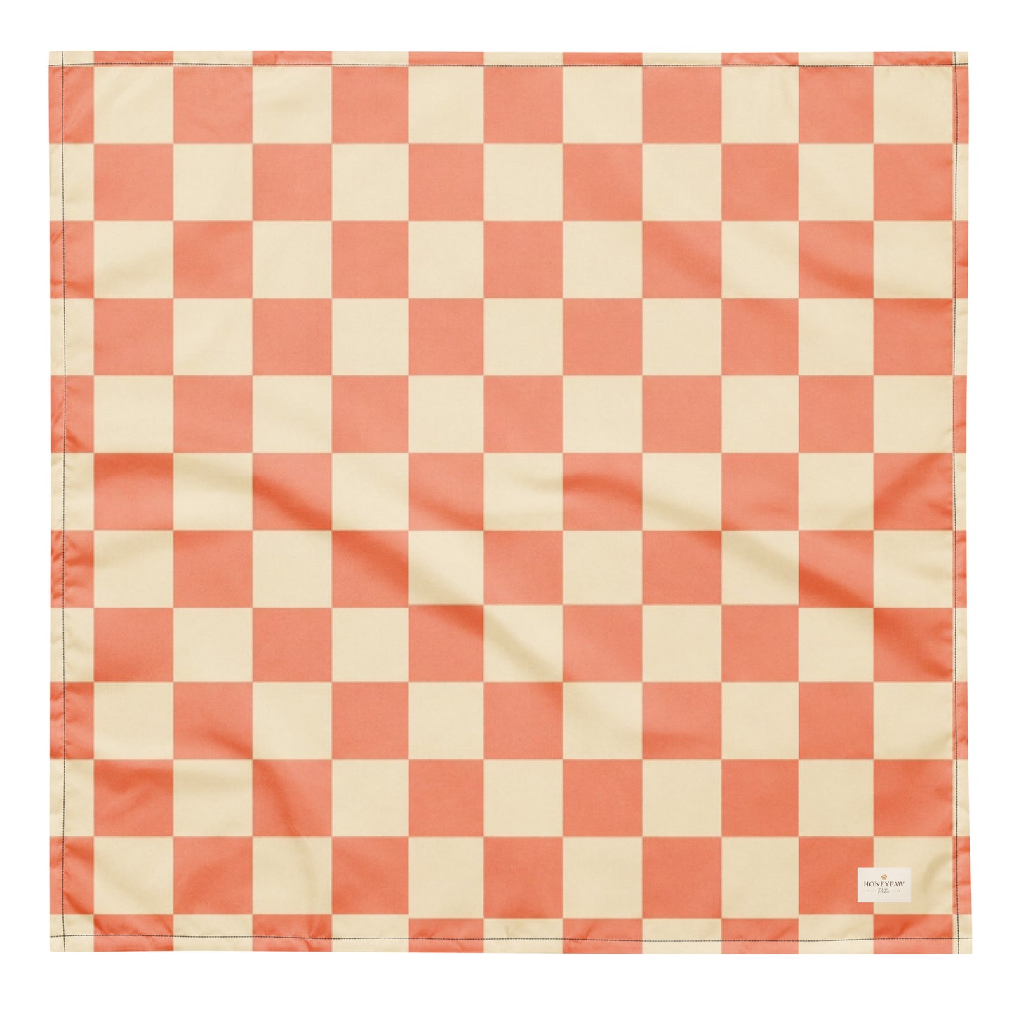 Pup Tart dog bandana featuring a coral pink and cream checkerboard pattern by HoneyPaw Pets.