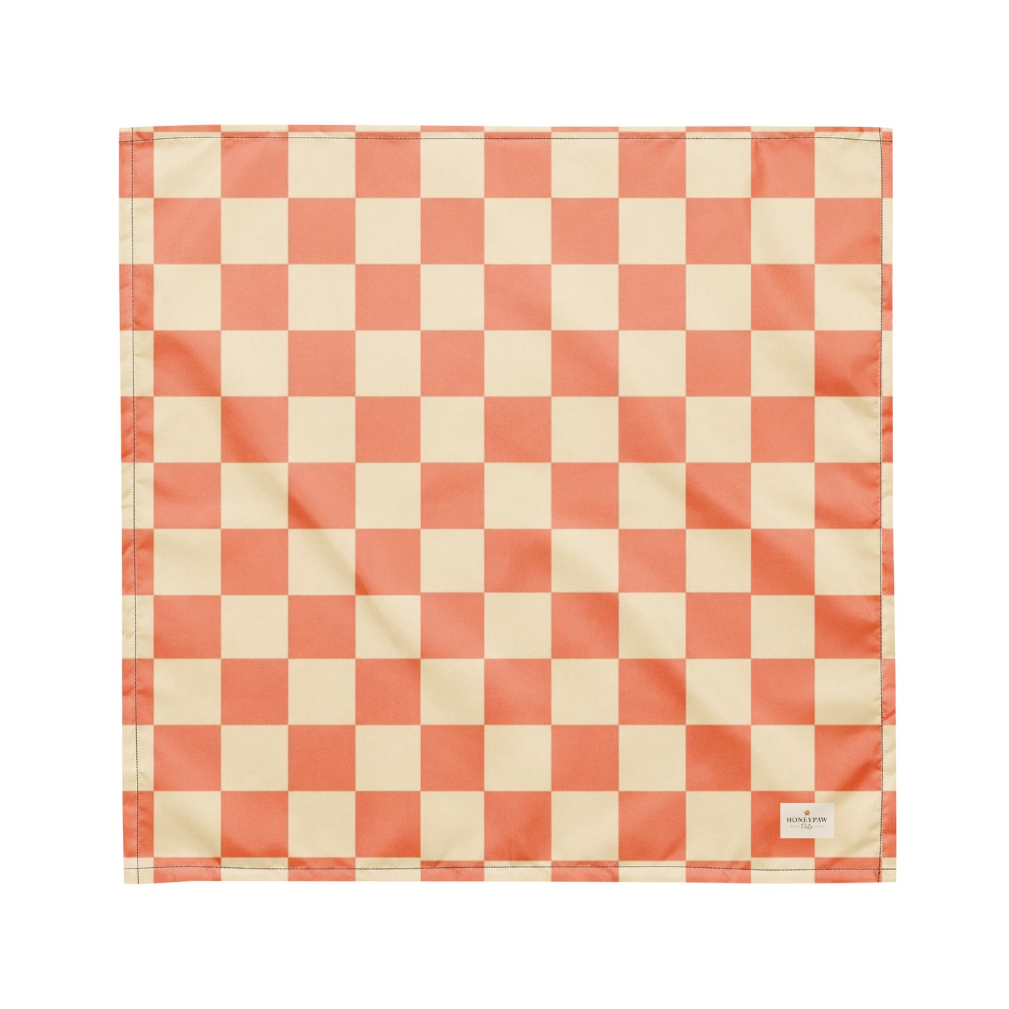 Pup Tart dog bandana featuring a coral pink and cream checkerboard pattern by HoneyPaw Pets.