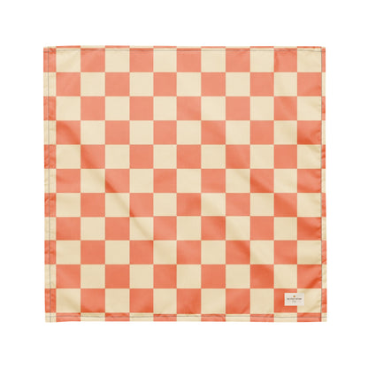 Pup Tart dog bandana featuring a coral pink and cream checkerboard pattern by HoneyPaw Pets.