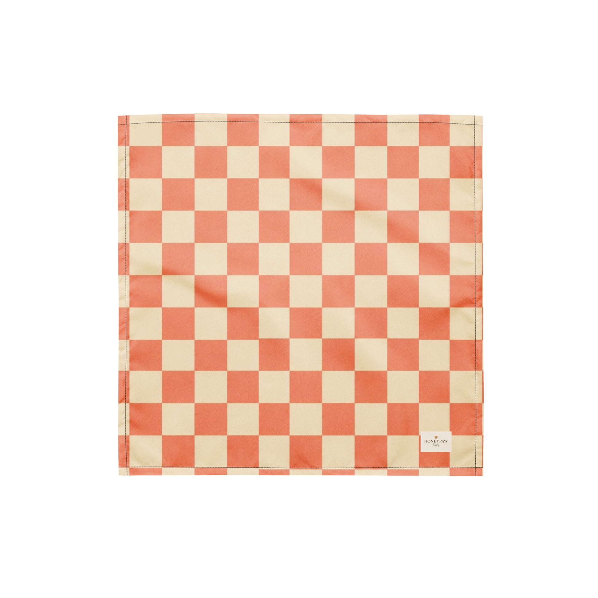 Pup Tart dog bandana featuring a coral pink and cream checkerboard pattern by HoneyPaw Pets.