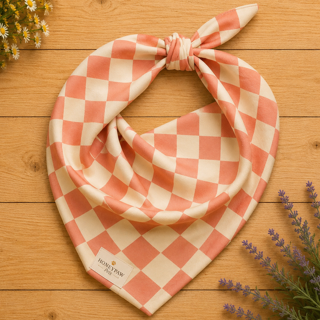 Pup Tart dog bandana featuring a coral pink and cream checkerboard pattern by HoneyPaw Pets.