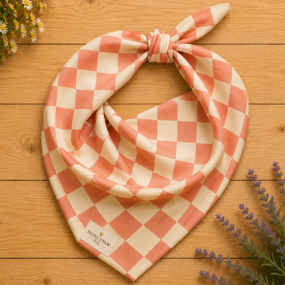 Pup Tart dog bandana featuring a coral pink and cream checkerboard pattern by HoneyPaw Pets.