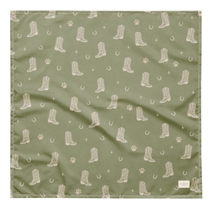 Rodeo Print western dog bandana featuring western cowboy boots, horseshoes, and paw prints on a sage green background by HoneyPaw Pets.