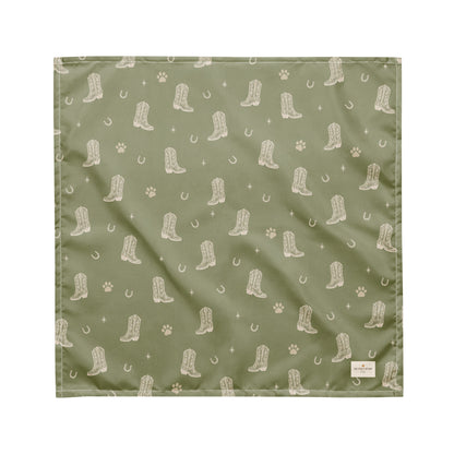 Rodeo Print western dog bandana featuring western cowboy boots, horseshoes, and paw prints on a sage green background by HoneyPaw Pets.
