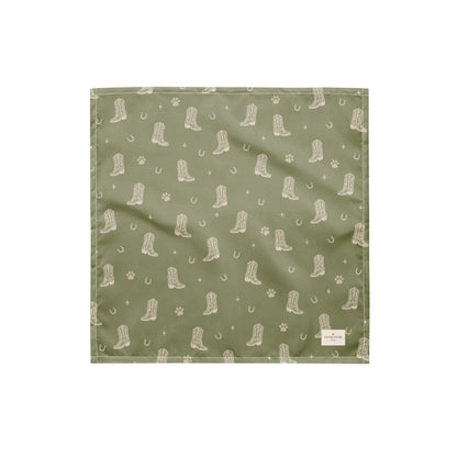 Rodeo Print western dog bandana featuring western cowboy boots, horseshoes, and paw prints on a sage green background by HoneyPaw Pets.