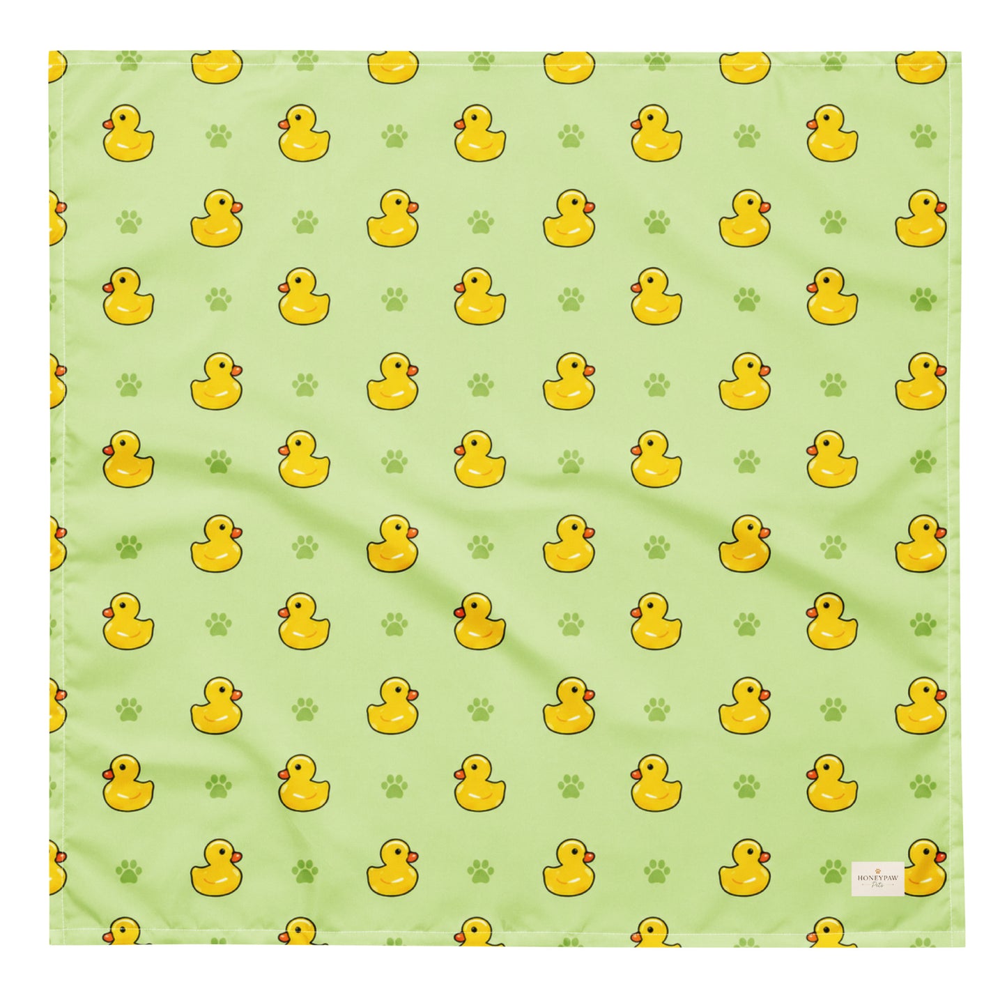 Rub-a-dub duck dog bandana featuring rubber ducks and paw prints on a green background by HoneyPaw Pets