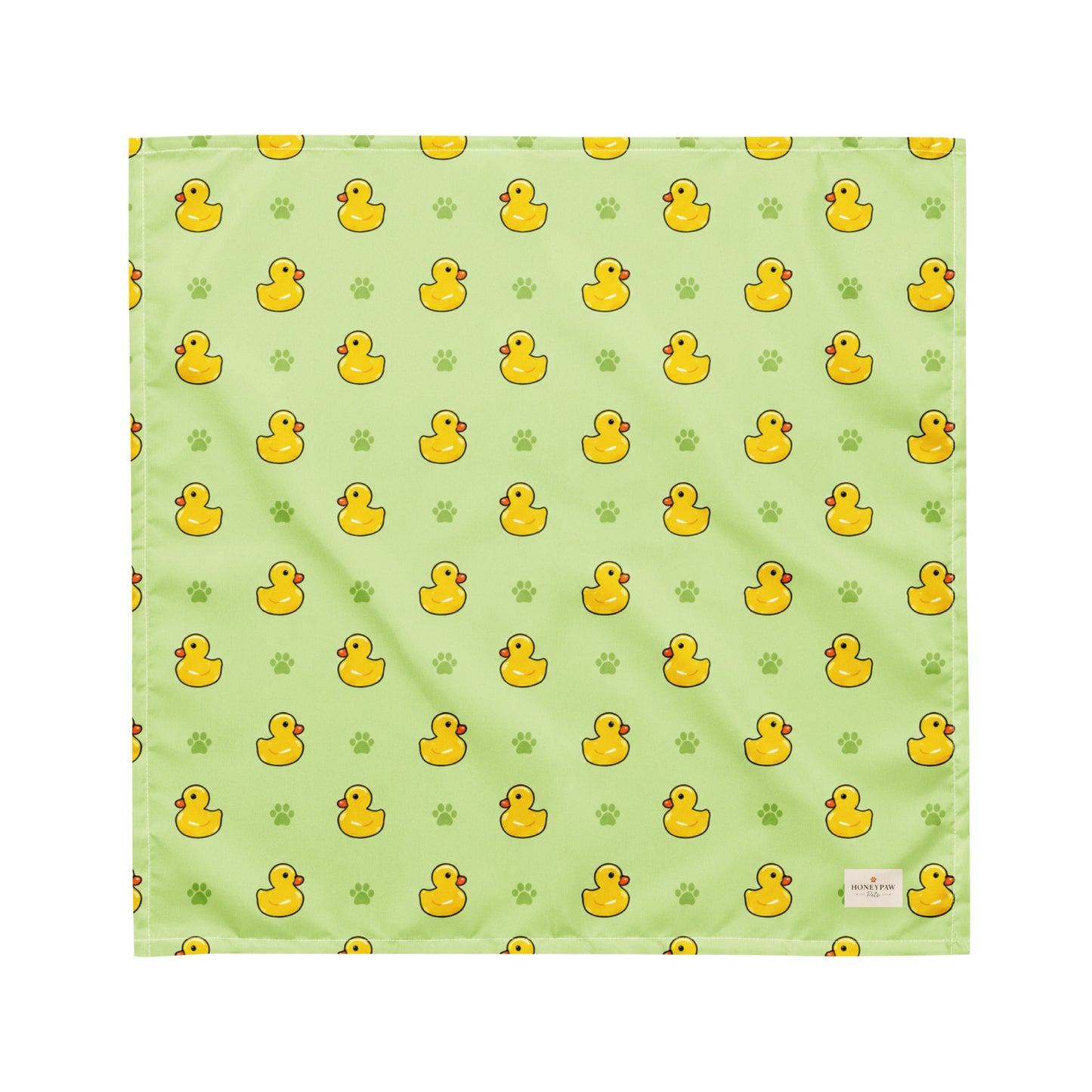 Rub-a-dub duck dog bandana featuring rubber ducks and paw prints on a green background by HoneyPaw Pets