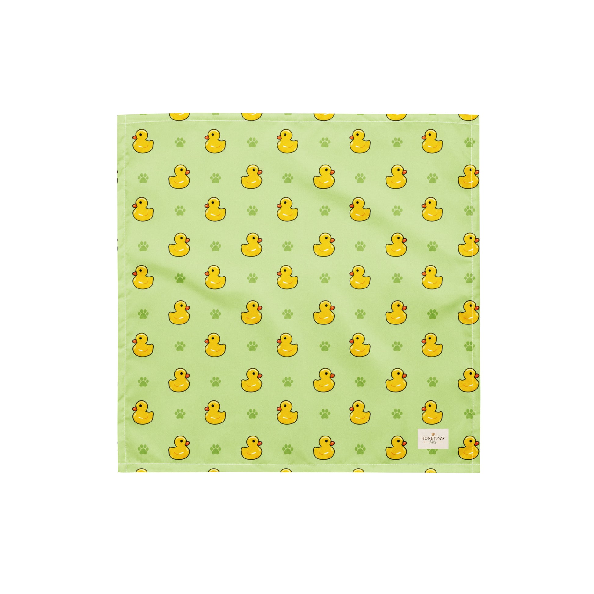 Rub-a-dub duck dog bandana featuring rubber ducks and paw prints on a green background by HoneyPaw Pets