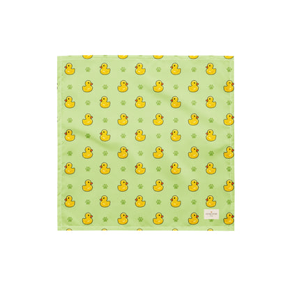 Rub-a-dub duck dog bandana featuring rubber ducks and paw prints on a green background by HoneyPaw Pets