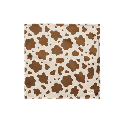 Saddle and Cattle dog bandana featuring a classic brown and cream cow print pattern inspired by western ranch style by HoneyPaw Pets.