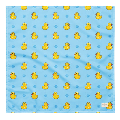 Splish Splash duck dog bandana featuring rubber ducks and paw prints on a blue background by HoneyPaw Pets