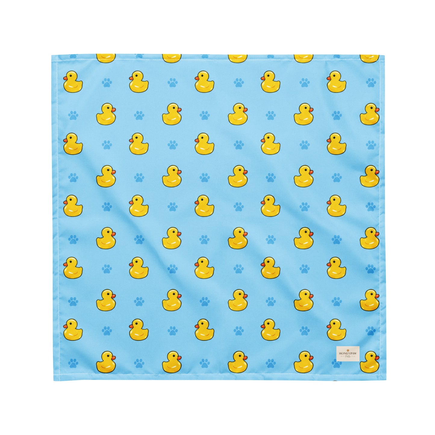 Splish Splash duck dog bandana featuring rubber ducks and paw prints on a blue background by HoneyPaw Pets