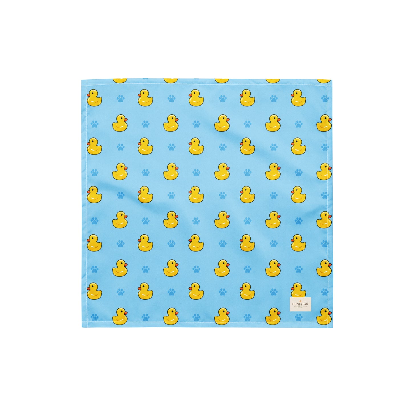 Splish Splash duck dog bandana featuring rubber ducks and paw prints on a blue background by HoneyPaw Pets