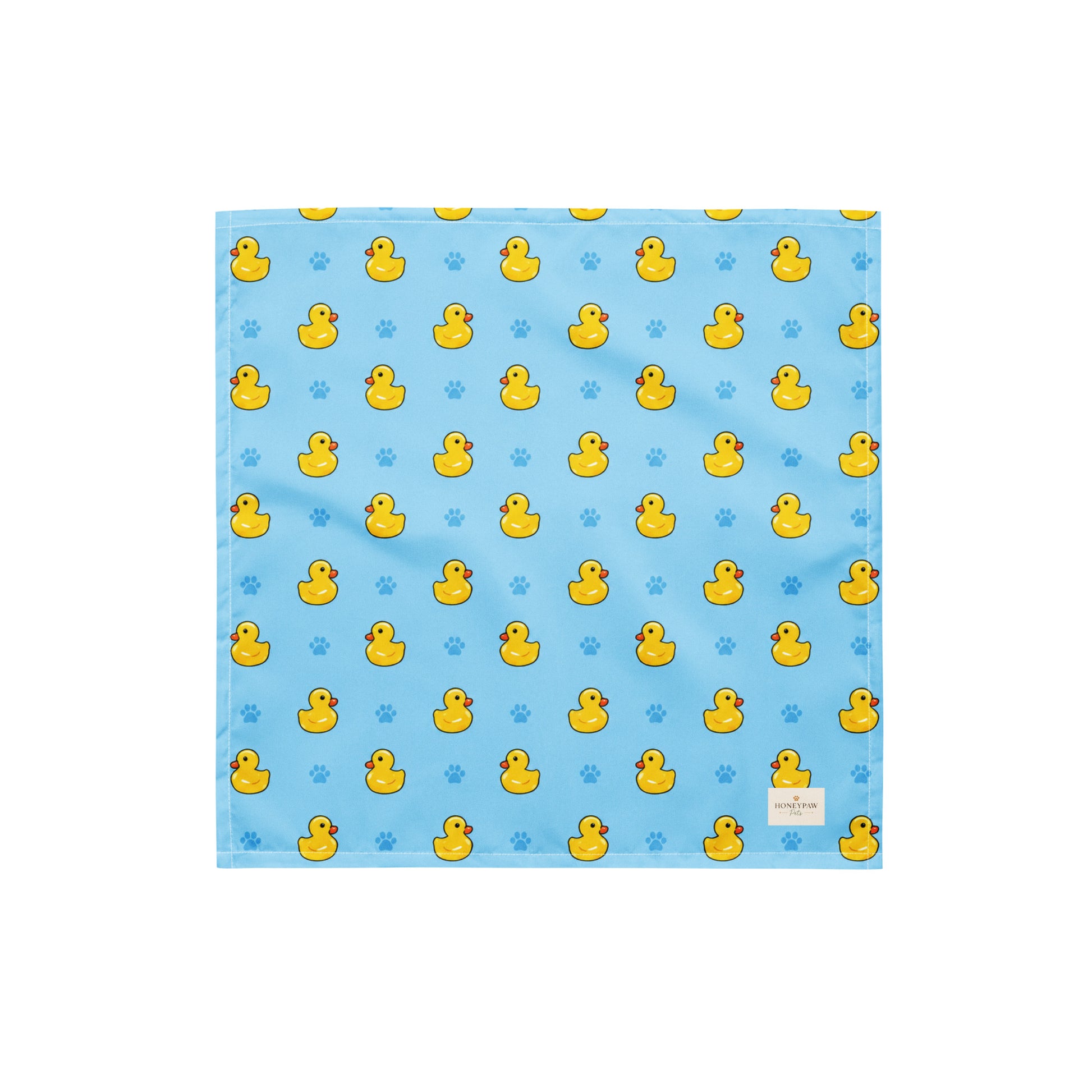 Splish Splash duck dog bandana featuring rubber ducks and paw prints on a blue background by HoneyPaw Pets