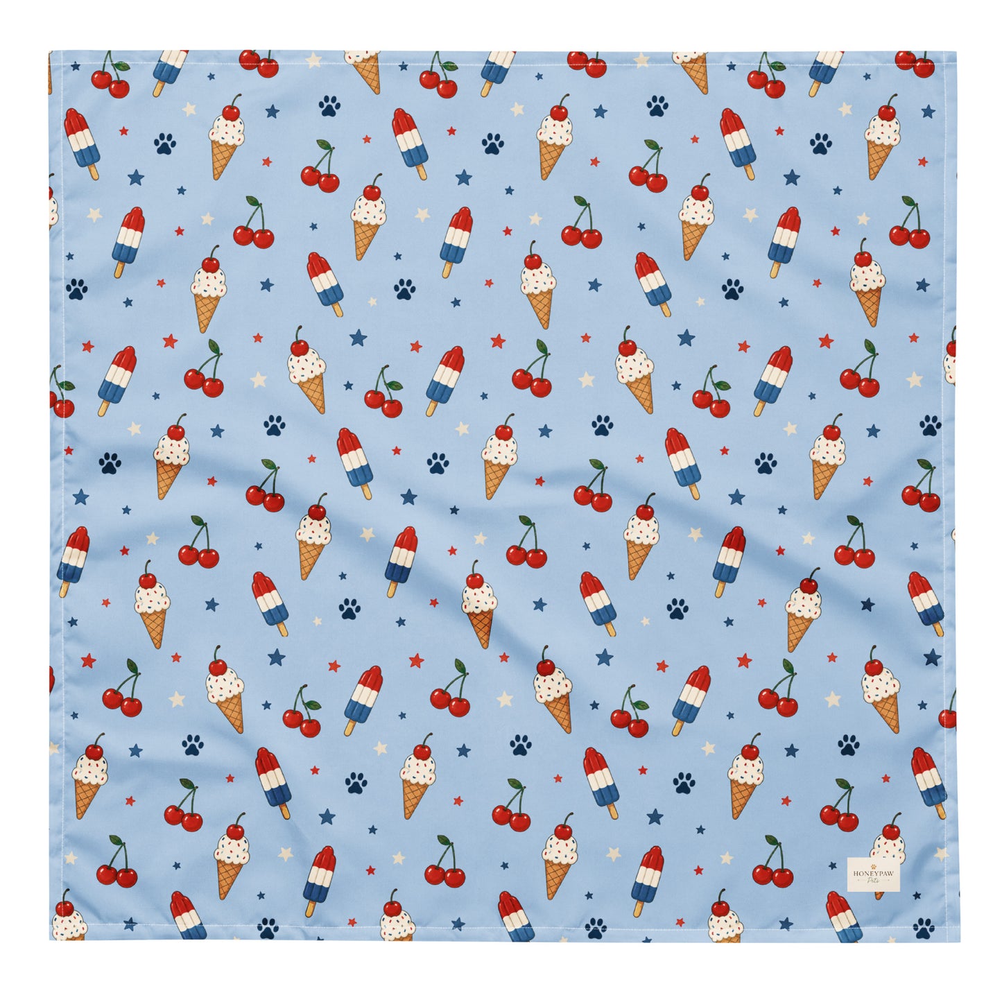 Stars and Sprinkles dog bandana featuring a patriotic ice cream and cherry pattern on a light blue background by HoneyPaw Pets.