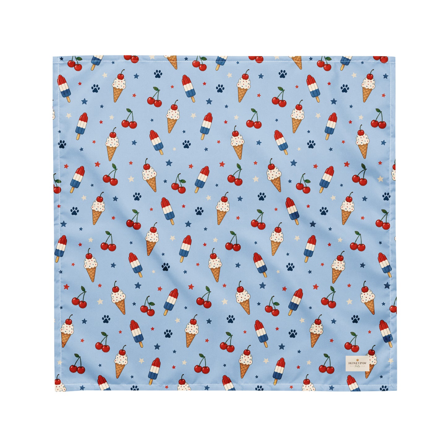 Stars and Sprinkles dog bandana featuring a patriotic ice cream and cherry pattern on a light blue background by HoneyPaw Pets.