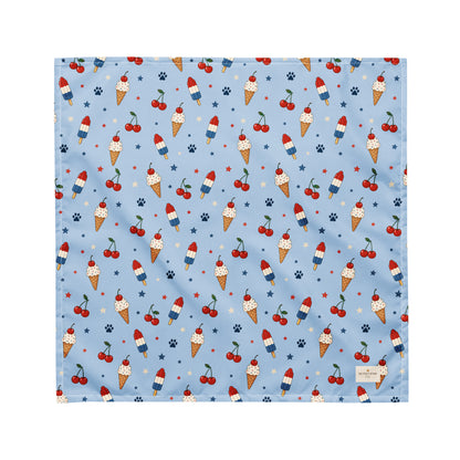 Stars and Sprinkles dog bandana featuring a patriotic ice cream and cherry pattern on a light blue background by HoneyPaw Pets.