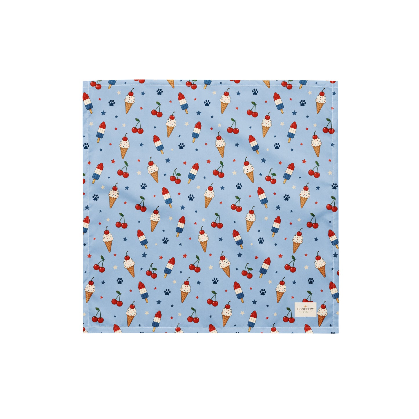 Stars and Sprinkles dog bandana featuring a patriotic ice cream and cherry pattern on a light blue background by HoneyPaw Pets.