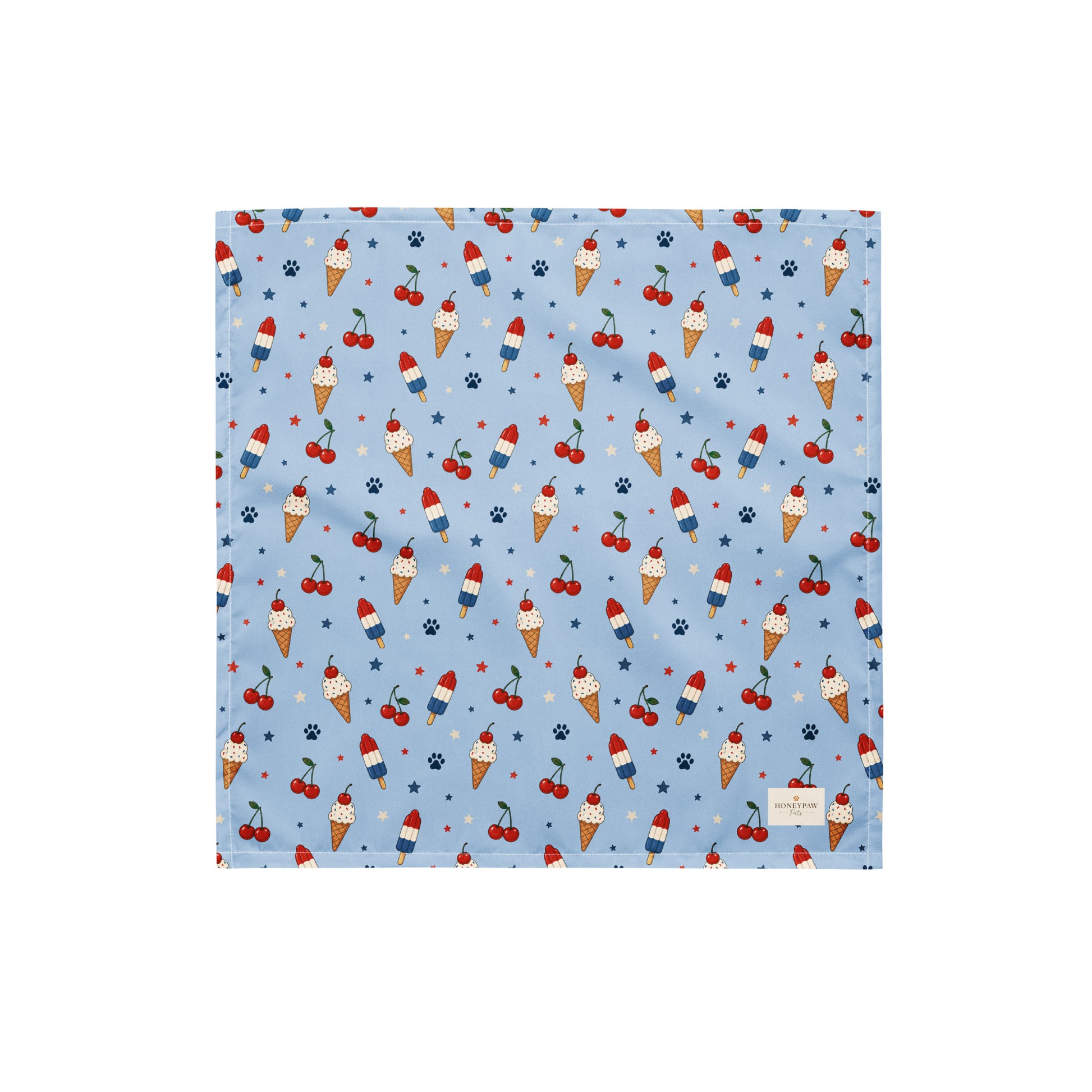 Stars and Sprinkles dog bandana featuring a patriotic ice cream and cherry pattern on a light blue background by HoneyPaw Pets.