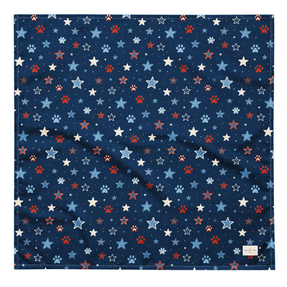 Stary Pup dog bandana featuring red, white, and blue stars with paw prints on a navy blue background by HoneyPaw Pets.
