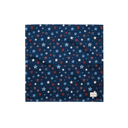 Stary Pup dog bandana featuring red, white, and blue stars with paw prints on a navy blue background by HoneyPaw Pets.