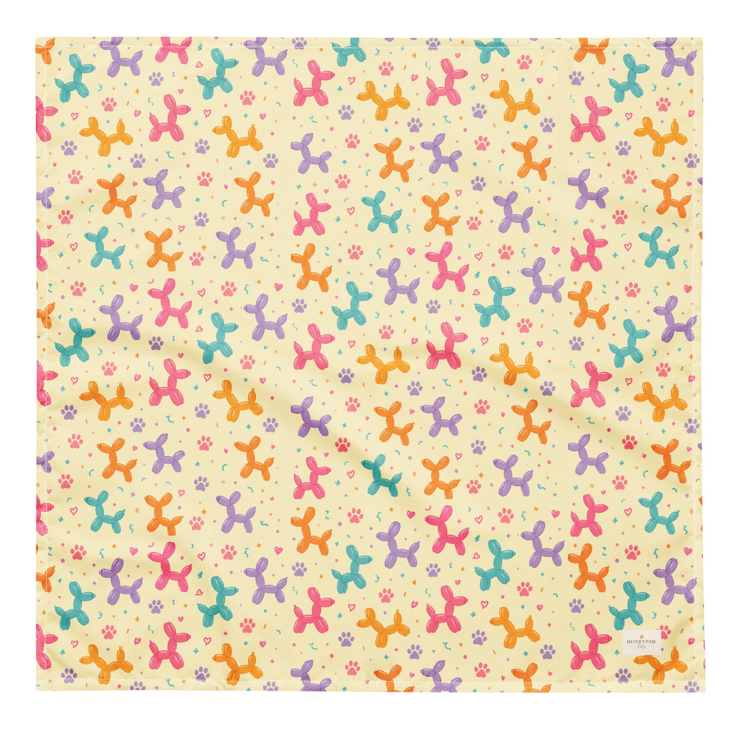 Sunny Squeaks birthday dog bandana featuring colorful balloon animals, confetti and paw prints on a light yellow background by HoneyPaw Pets