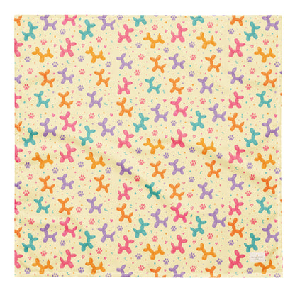 Sunny Squeaks birthday dog bandana featuring colorful balloon animals, confetti and paw prints on a light yellow background by HoneyPaw Pets