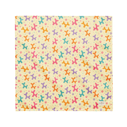 Sunny Squeaks birthday dog bandana featuring colorful balloon animals, confetti and paw prints on a light yellow background by HoneyPaw Pets