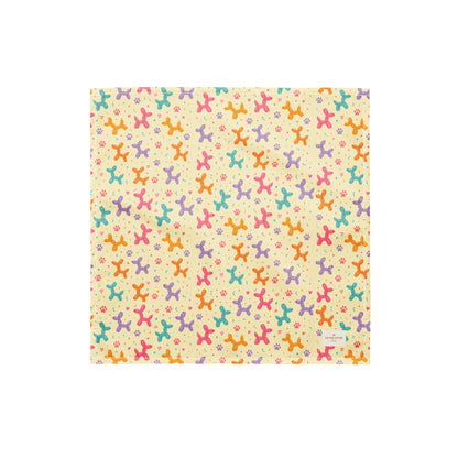 Sunny Squeaks birthday dog bandana featuring colorful balloon animals, confetti and paw prints on a light yellow background by HoneyPaw Pets