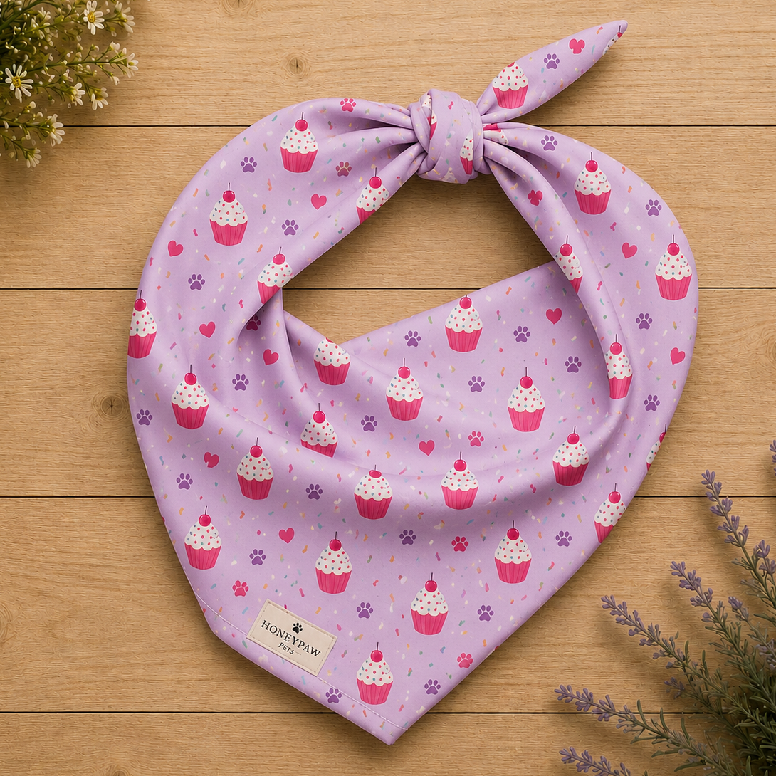 Sweet Celebrations birthday dog bandana featuring colorful cupcakes, hearts and paw prints on a light purple background by HoneyPaw Pets