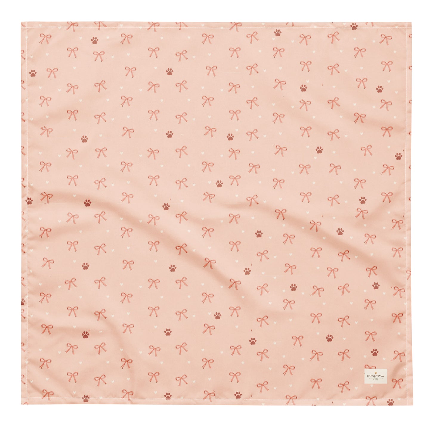 Sweetheart Pup Display dog bandana featuring delicate bow and paw print accents on a blush pink background by HoneyPaw Pets.