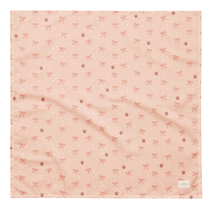 Sweetheart Pup Display dog bandana featuring delicate bow and paw print accents on a blush pink background by HoneyPaw Pets.