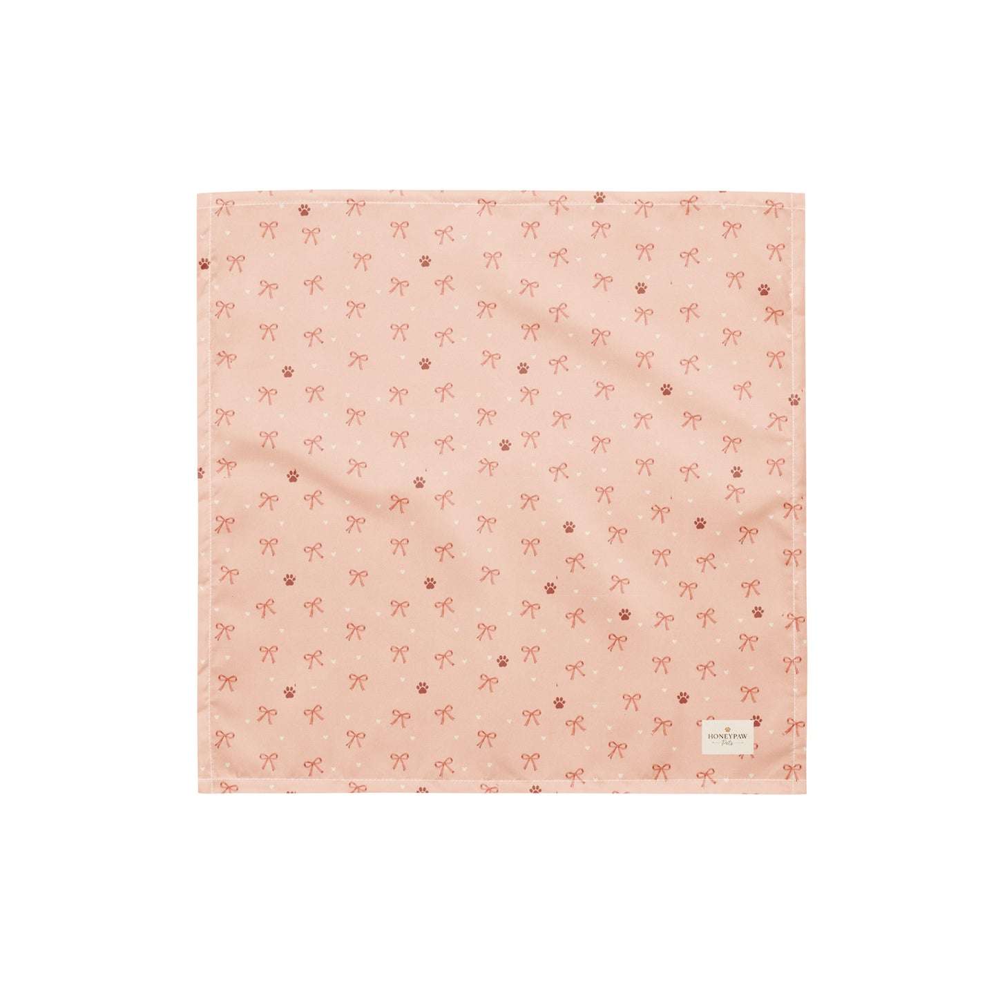 Sweetheart Pup Display dog bandana featuring delicate bow and paw print accents on a blush pink background by HoneyPaw Pets.