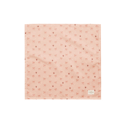 Sweetheart Pup Display dog bandana featuring delicate bow and paw print accents on a blush pink background by HoneyPaw Pets.